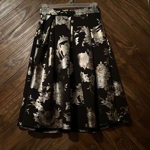 Charlotte Russe knee length skirt. Color: black. Size: M. Pattern: floral
